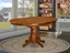 Contemporary Round Wood Extendable Dining Table in Saddle Brown