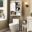 White Over-the-Toilet Storage Cabinet with Adjustable Shelves and Barn Door