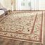 Ivory and Red Tufted Synthetic 10' x 14' Area Rug