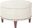 Alloway Cream Faux Leather Round Storage Ottoman with Antique Bronze Nailheads