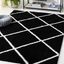 Black and White Geometric Shag 9' x 12' Synthetic Area Rug