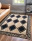 Square Black and Light Brown Geometric Animal Print Rug