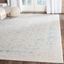 Ivory and Turquoise 9' x 12' Vintage Distressed Area Rug