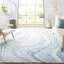 Handmade Blue and Ivory Wool Abstract Area Rug