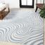 Light Blue and Ivory Abstract 4' x 6' Synthetic Area Rug