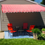 Motorized Retractable Red and White Striped Patio Awning