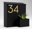 Black Wall-Mounted Mailbox with Brass Numbers and Planter