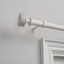 Distressed White Iron Adjustable Curtain Rod with Ribbed Finials