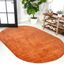 6'2" x 9' Oval Orange Synthetic Low-Pile Area Rug